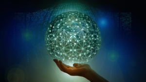 Hand holding a glowing network globe of interconnected nodes against a digital-code backdrop—visual metaphor for the AI Culture Playbook and augmented intelligence.